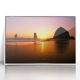 Acrylic print of Cannon Beach, Oregon, in muted gray tones, framed in white, suitable for modern art wall decor.