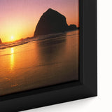Framed canvas of Cannon Beach with a textured black foreground and colorful sunset sky, ideal for living room decor.