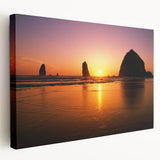 Large art print of Cannon Beach, Oregon, featuring muted earth tones on stretched canvas, ideal for kitchen wall art.