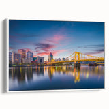 Vintage poster art of Pittsburgh skyline in vibrant colors on a framed canvas, ideal for living room decor.