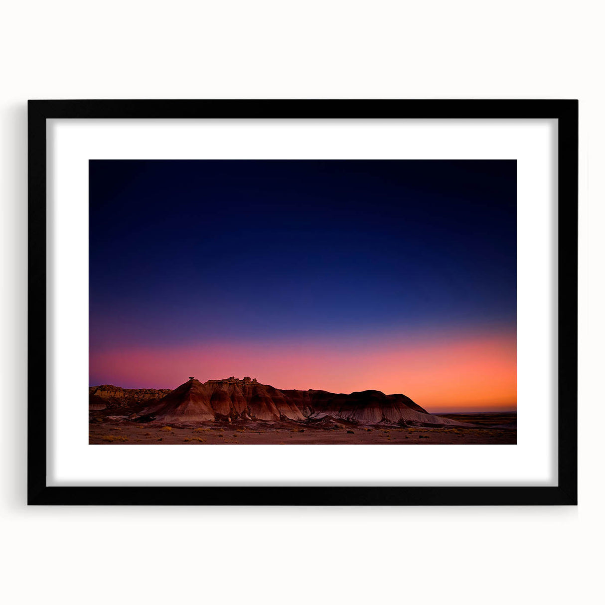 Extra large abstract art print of South Dakota Badlands in vibrant, colorful hues on a textured canvas, framed in black.