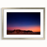 Textured art depicting the Badlands in South Dakota, rendered in muted earth tones on a framed silver mat.