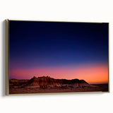 Framed canvas of vintage-style Badlands landscape in muted gold and black, ideal for bedroom wall art.