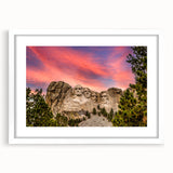 Art deco poster of Mt. Rushmore in muted gray tones, framed in white, suitable for modern nursery decor.