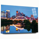 Large abstract wall art of Nashville skyline in muted blue and gray tones on acrylic glass.
