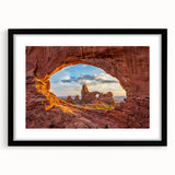 Extra large colorful art print of abstract Utah Arches scenery on textured canvas, framed in black.