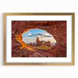 Extra large wall art depicting abstract Utah Arches in textured orange and red hues, framed in gold.