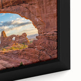 Extra large framed canvas featuring a textured depiction of Arches National Park in Utah with vibrant earth tones.