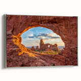Framed canvas landscape art painting featuring Arches National Park in Utah with a colorful sky and black border.