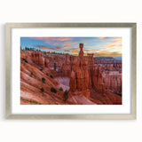 Textured art of abstract Bryce Canyon in vibrant orange and red hues on a silver-framed mat, suitable for bedroom art.