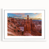 Abstract art print of Bryce Canyon in muted orange and red tones on a white framed canvas, ideal for dining room decor.