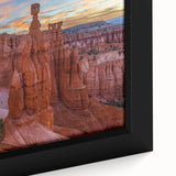 Close-up of a framed canvas depicting Bryce Canyon in textured, vibrant colors on a black background.