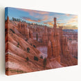 Large art print of Bryce Canyon in muted orange and red tones on stretched canvas, suitable for kitchen wall art.