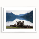 Abstract art print of Olympic National Park in muted green and blue tones on a framed white mat, ideal for dining room decor.