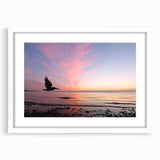 Abstract art print of Seattle skyline in muted gray, framed in white, suitable for bedroom or dining room decor.