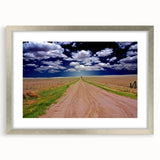 Textured art depicting abstract West Virginia scenery in muted earth tones on a framed silver mat.