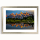 Textured art print of the Grand Tetons in muted earth tones on a framed silver mat, ideal for bedroom decor.