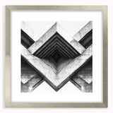 Textured abstract art print in muted gray and silver tones, displayed in a silver frame, ideal for modern bedroom ambiance.