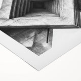 Art deco poster featuring geometric patterns in black and gold on rolled canvas.