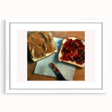 Abstract art print of assorted pastries in soft pastel tones on a white framed poster, suitable for dining room decor.