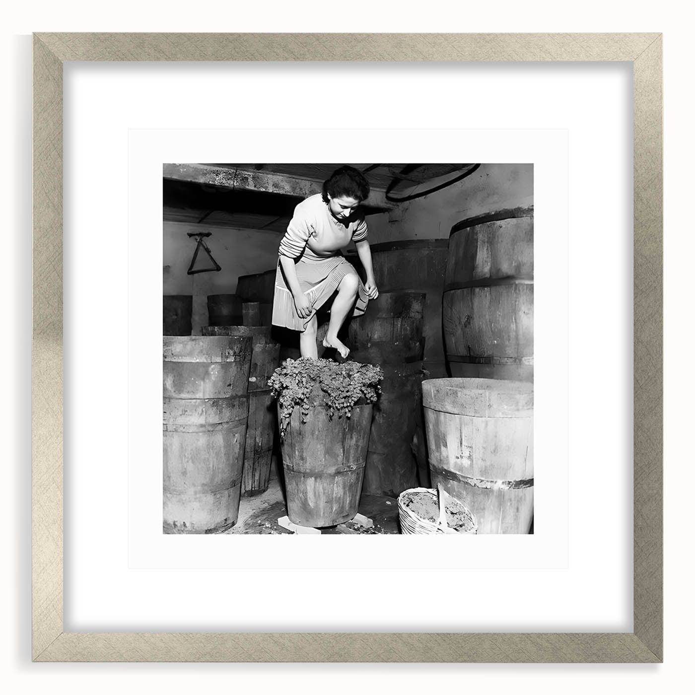 Textured art print featuring abstract shapes in muted earth tones, framed in silver, ideal for bedroom ambiance.