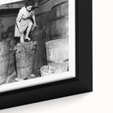 Close-up of a framed canvas featuring black wall art with colorful, textured depictions of people dining.