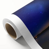 Rolled canvas print showcasing vibrant African tribal art design, featuring intricate patterns and warm colors, securely packaged in a durable cardboard tube for shipping.