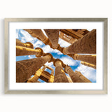 Abstract art print of an Egyptian landscape in muted earth tones, framed in silver, suitable for dining room decor.