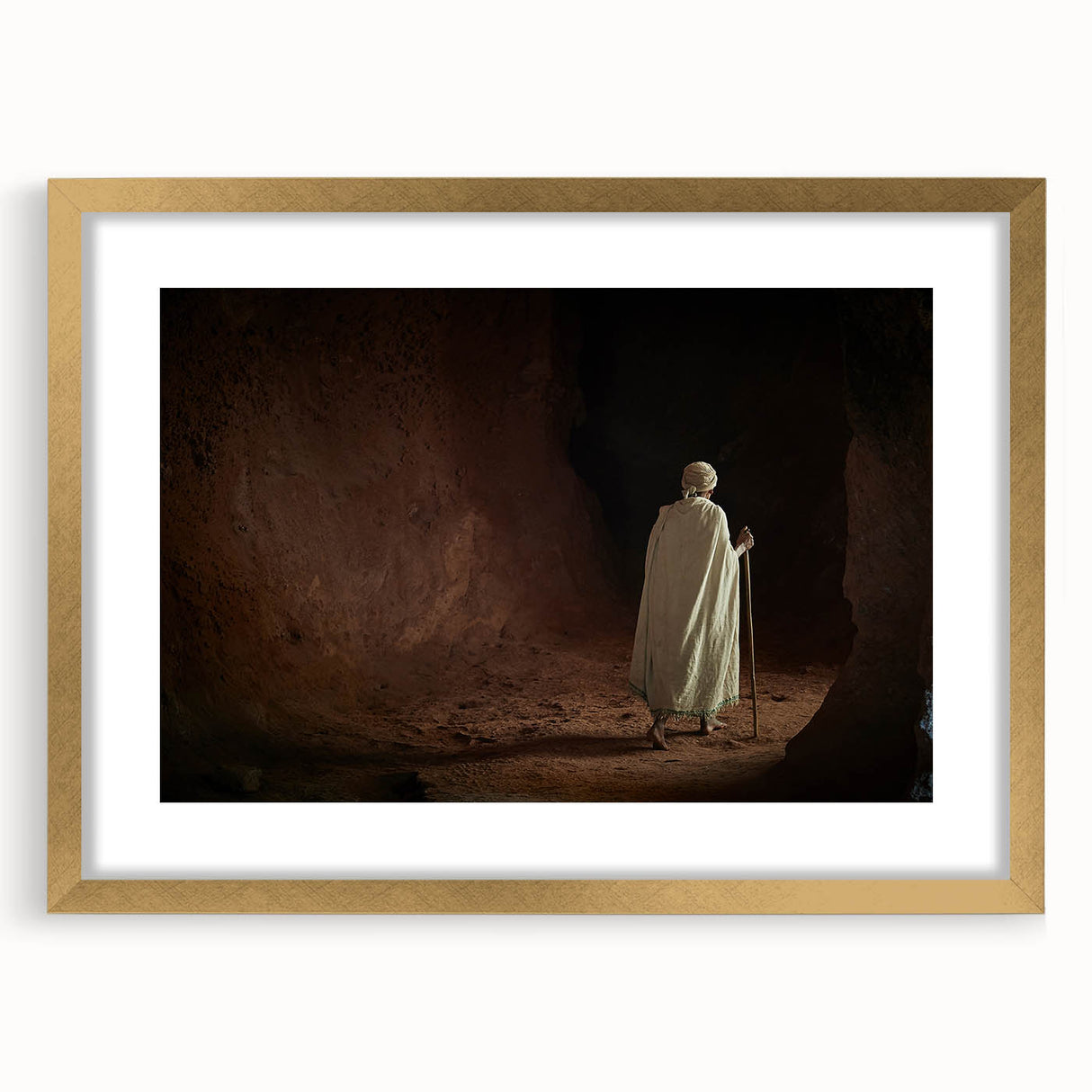 Textured abstract art print depicting Ethiopian scenery in earthy tones on a gold-framed canvas, suitable for bedroom decor.