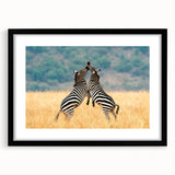 Extra large wall art featuring an abstract depiction of the African scenery in textured earth tones, framed in black.