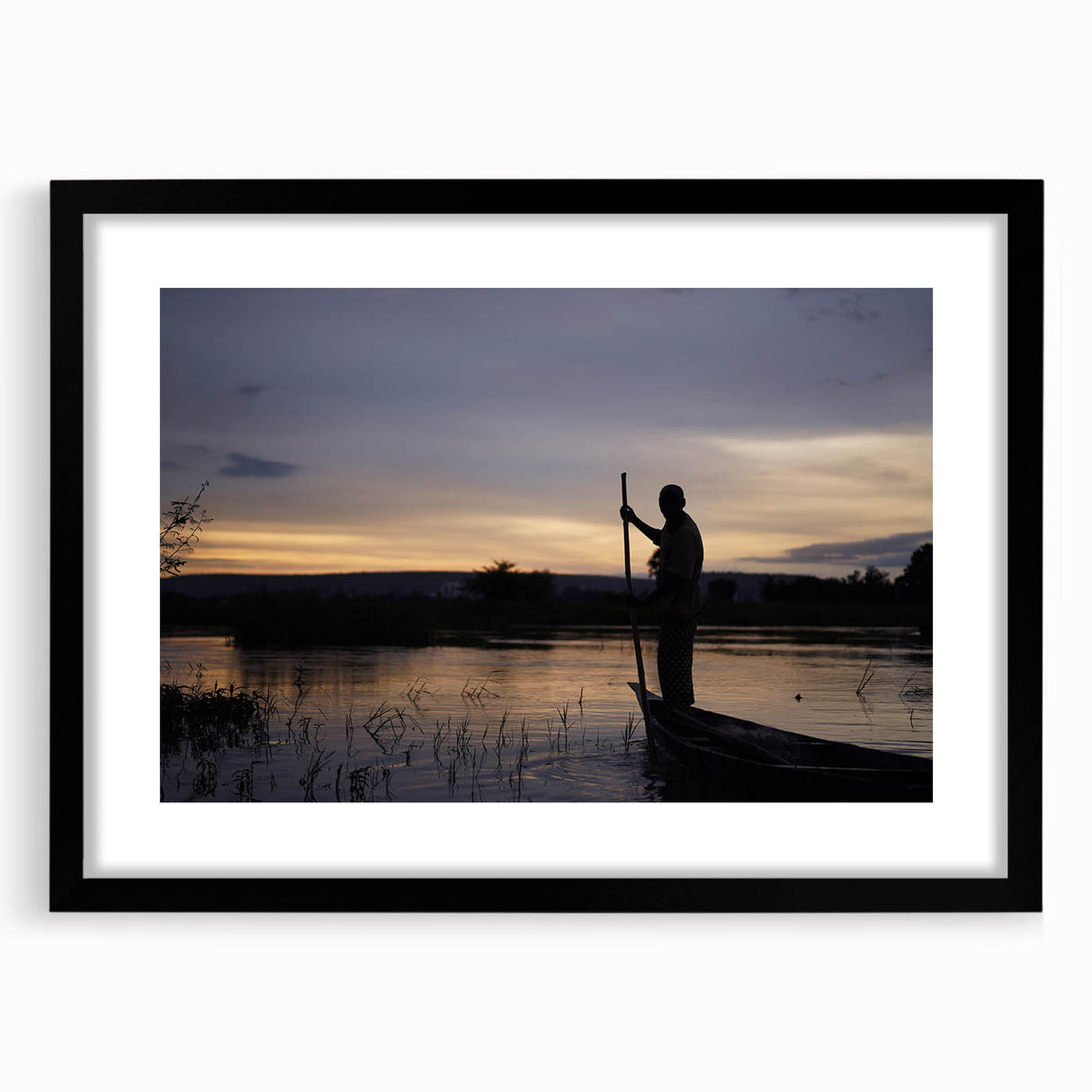 Extra large abstract art print featuring a textured, colorful depiction of a Mali landscape on a framed black mat.