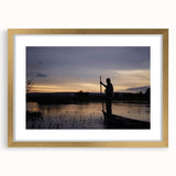 Textured abstract art print depicting a Mali scene in earth tones, framed in gold, ideal for bedroom art.