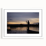 Extra large abstract art print of an African scenery in textured earth tones on a white framed canvas.