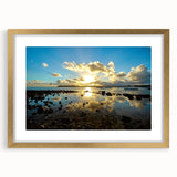 Textured art print of abstract African scenery in earthy tones on a gold-framed canvas, suitable for bedroom decor.