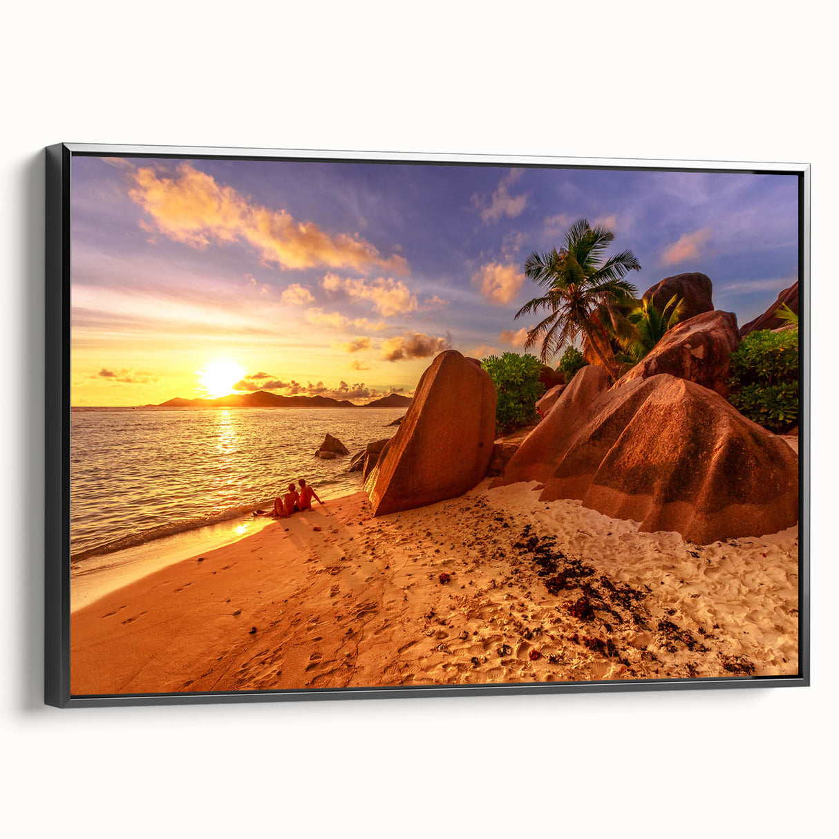 Black and white wall art featuring a vintage poster-style landscape of the Seychelles on a framed canvas.