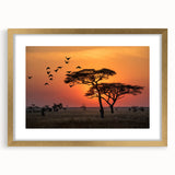 Extra large framed wall art depicting an abstract African savanna scene in textured gold and earth tones.