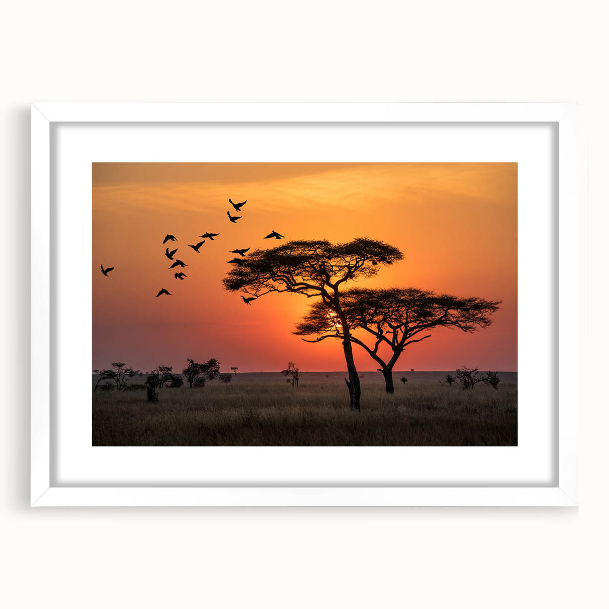 Abstract art print of Tanzanian scenery in muted earth tones on a framed white mat, ideal for dining room decor.
