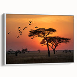 Vintage poster art of a Tanzanian landscape on a framed canvas, featuring colorful art with black accents.