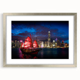 Textured art print of abstract Hong Kong skyline in muted grays and blues, framed in silver, ideal for bedroom decor.