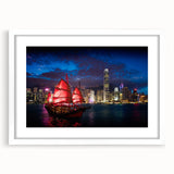 Abstract art print of Hong Kong skyline in muted gray and blue tones on a framed white mat.