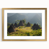 Extra large abstract art print depicting a textured Indonesian landscape in muted earth tones, framed in gold.