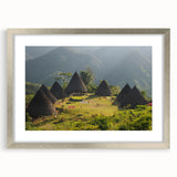 Textured abstract art print of Indonesian scenery in muted earth tones on a framed silver mat, suitable for bedroom decor.