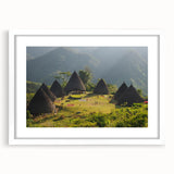 Abstract art print of an Indonesian landscape in muted earth tones on a white framed canvas, suitable for dining room decor.