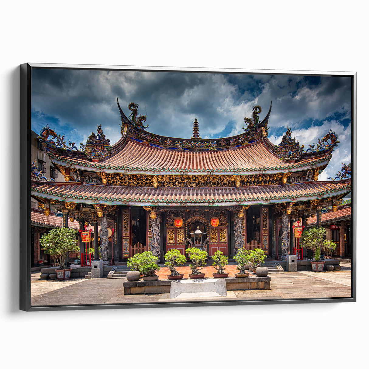Black and white wall art featuring a vintage landscape painting of a Japanese scene on a framed canvas.