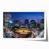 Rolled print of Seoul cityscape with soft pink cherry blossoms on a muted background, suitable for art wall dining room.