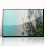 Large abstract wall art depicting the Maldives seascape in vibrant blues and greens on a black framed acrylic.