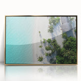 Large art print of a serene Maldivian beach scene on a framed acrylic, featuring soft blue and sandy tones.