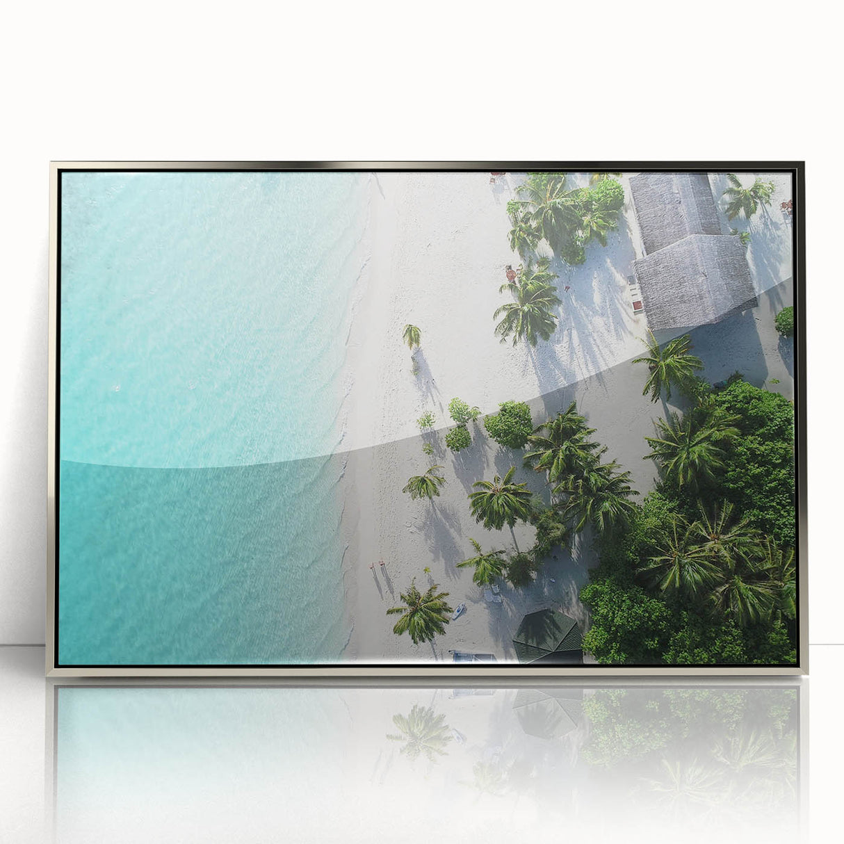 Mid-century modernist art featuring a serene Maldives beach scene in muted blue and white tones, silver-framed acrylic.