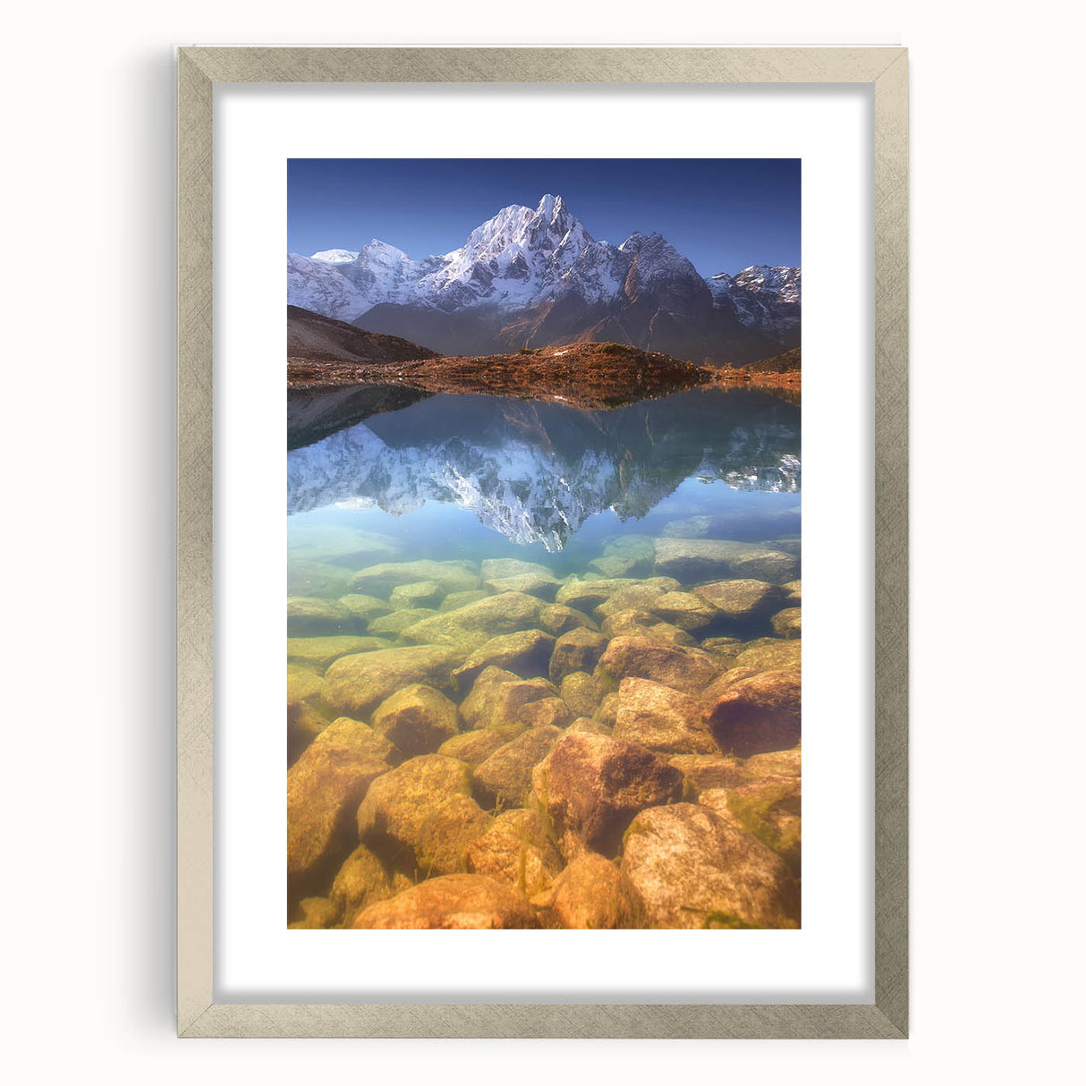 Textured art print of abstract mountain scenery in muted earth tones on a framed silver mat, ideal for bedroom art.