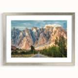 Abstract textured art print depicting a serene Pakistani landscape in muted earth tones, framed in silver.